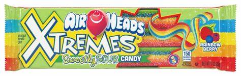 Hand holding Airheads Xtremes Rainbow Berry Belts pack – fun snack moment