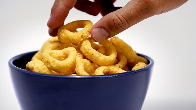 Crunchy hot onion ring snacks ready to eat