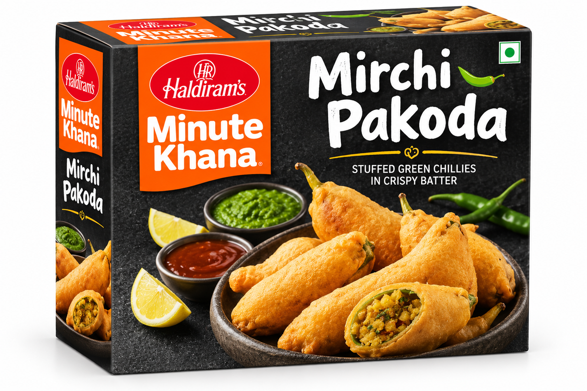 Haldiram’s Minute Khana Mirchi Pakoda 280g box featuring orange and black packaging, crispy golden stuffed green chilli pakodas served with green chutney, red sauce, and lemon wedges.