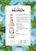 MONIN Frosted Mint Syrup bottle next to mojito cocktail and lime