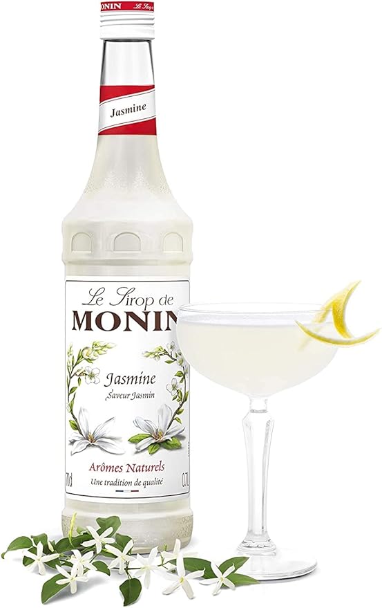 Monin Premium Jasmine Syrup 700ml bottle with a floral design, offering a delicate jasmine flavor perfect for cocktails, mocktails, teas, and desserts. Vegan-friendly and allergen-free.