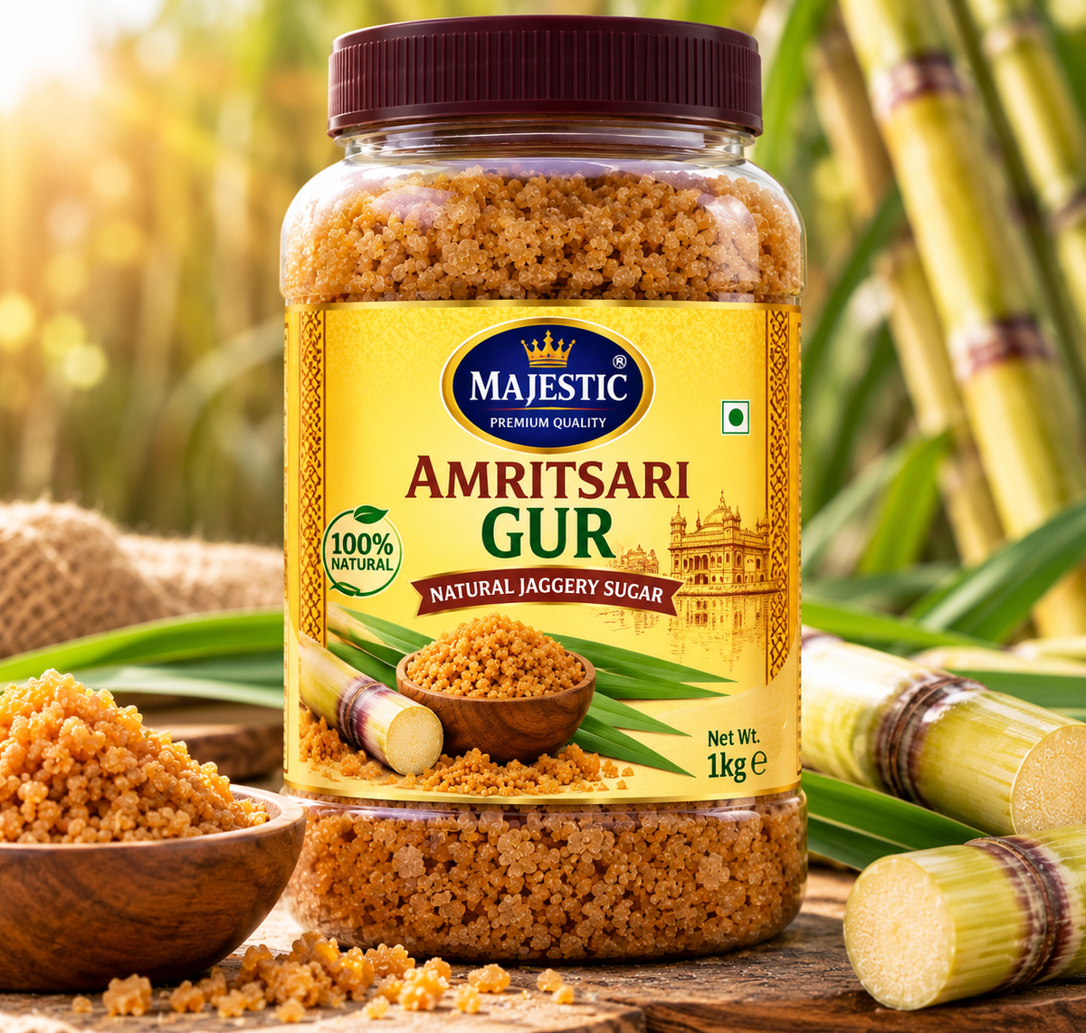 Majestic Amritsari Gur 1kg jar featuring golden-brown jaggery granules, a maroon lid, a yellow premium label, and sugarcane imagery.