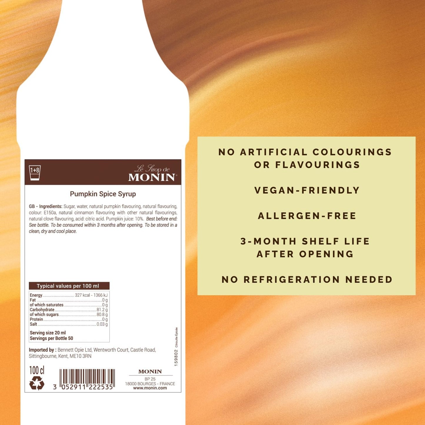 Monin Pumpkin Spice Syrup bottle with label on an orange background