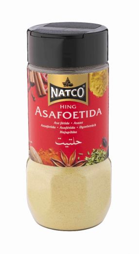 Natco Hing Asafoetida 100g jar front view showing red branded label with black lid and clear plastic container filled with fine light yellow asafoetida powder spice for Indian cooking.