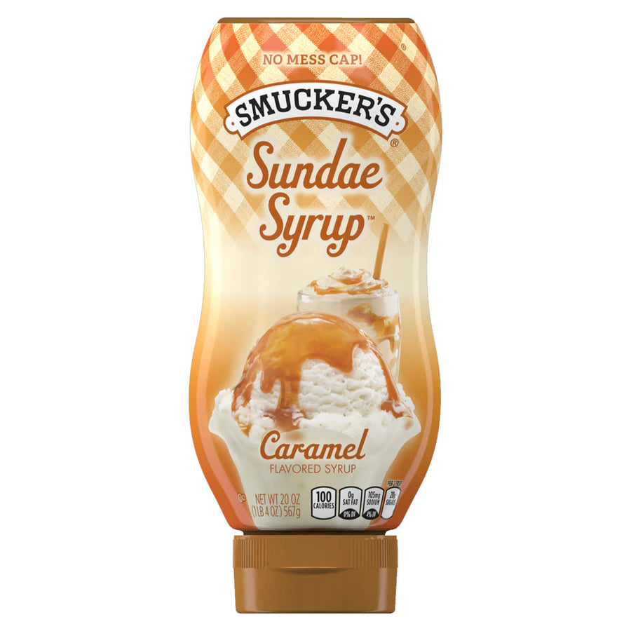 A squeezable bottle of Smucker’s Caramel Sundae Syrup (567 g) with a flip-top cap, featuring a caramel drizzle design on the label.