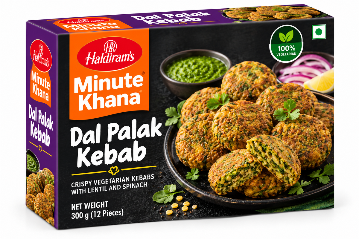 Haldiram’s Minute Khana Dal Palak Kabab 300g box featuring purple, orange and black packaging, golden lentil and spinach kebabs with fresh spinach leaves, sliced onions, lemon wedges, coriander, and green chutney.