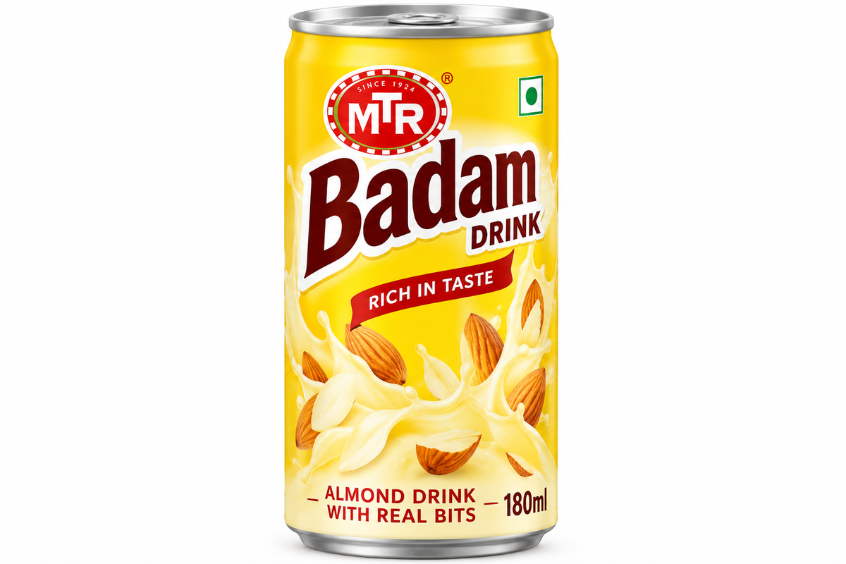 MTR Badam Drink 180ml can featuring bright yellow packaging, red MTR logo, almond illustrations, creamy milk splash graphics, and Badam Drink branding.