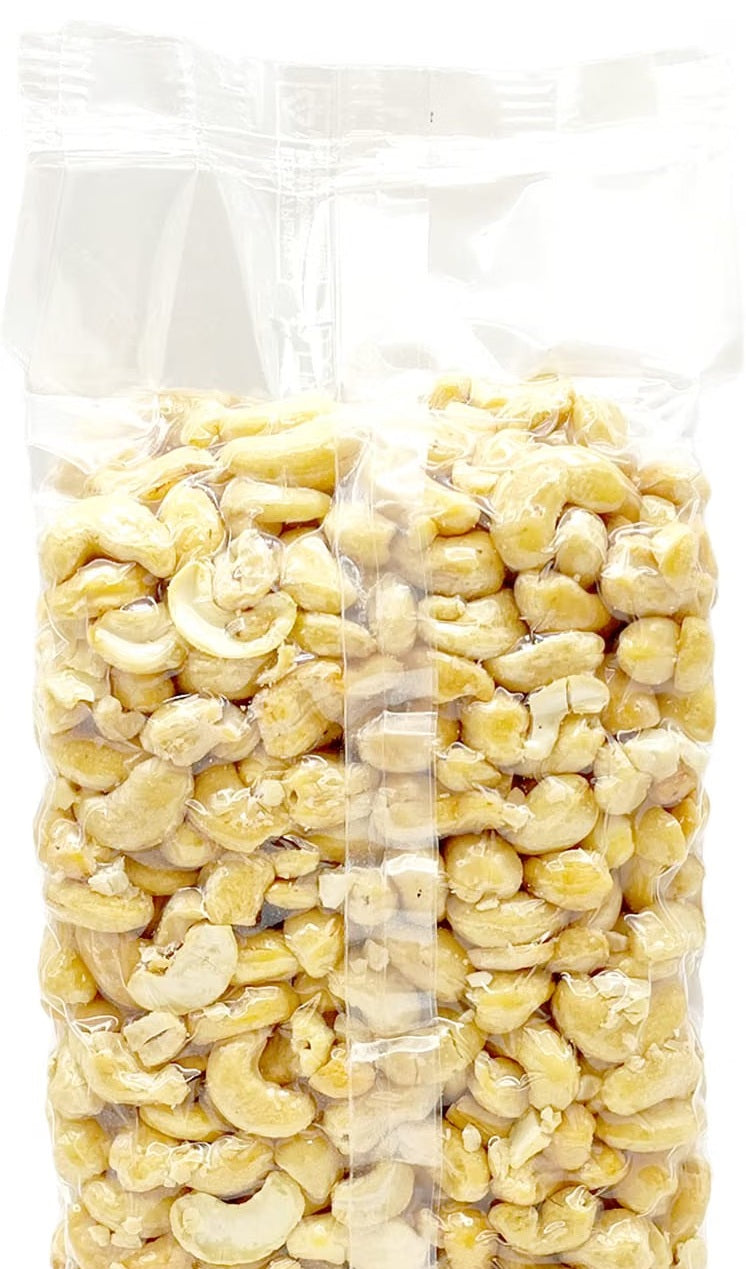 Oltresole Raw Cashews 1kg natural unroasted cashew nuts in clear vacuum-packed packaging, featuring a generous quantity of whole, split and broken cashew pieces, ideal for snacking, baking, cooking, desserts, salads and homemade recipes.