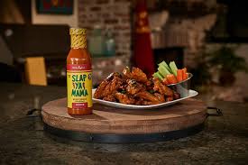 Louisiana-style Slap Ya Mama Buffalo Wing Sauce with tangy heat and smooth texture