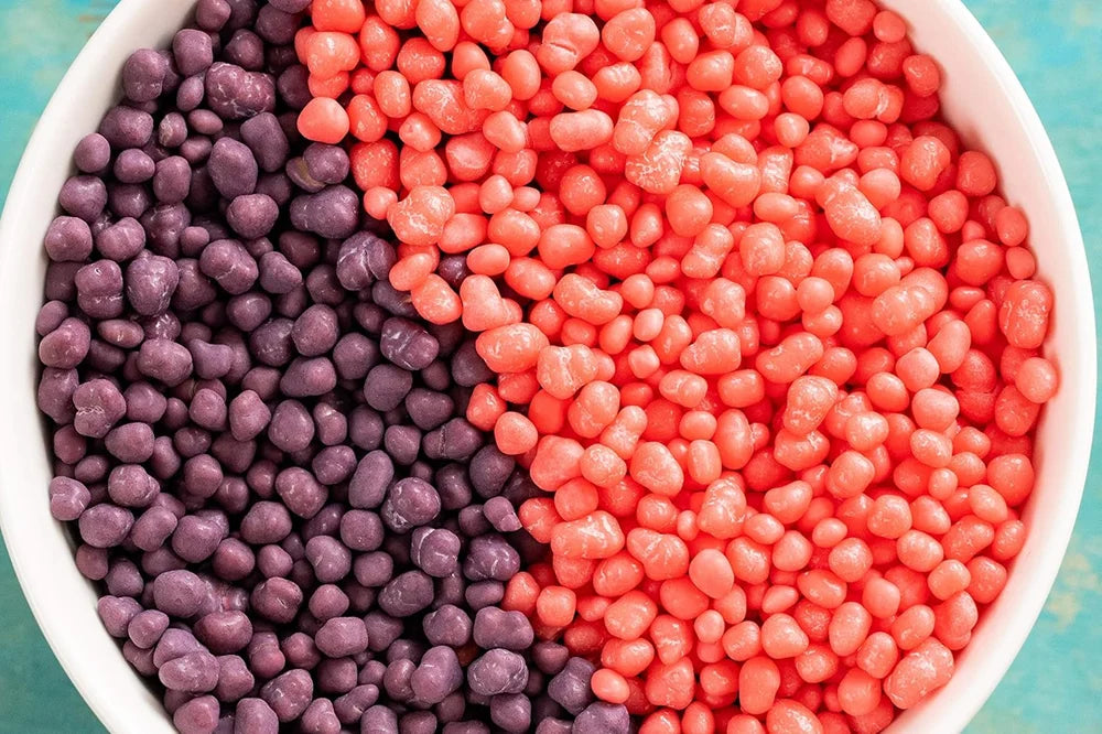 A box of Ferrara Nerds Grape & Strawberry, featuring crunchy candy with tangy grape and sweet strawberry flavors in a convenient, easy-to-carry package.