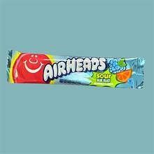 Airheads Sour Blue Blast candy bar in bright blue wrapper, chewy sour blue raspberry candy with vibrant color and fun, bold flavor, shown against a plain background