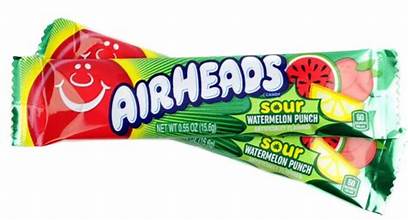 Airheads Sour Watermelon Punch candy bar in bright pink and green wrapper, chewy sour watermelon-flavored candy with bold, tangy taste, shown against a plain background.