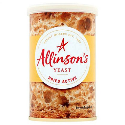 Premium lifestyle image of Allinson's Dried Active Yeast displayed with freshly baked artisan bread and baking ingredients, highlighting its reliable performance for light, fluffy and perfectly risen bakes.