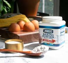 Multiple Argo Baking Powder cans arranged in a bulk case
