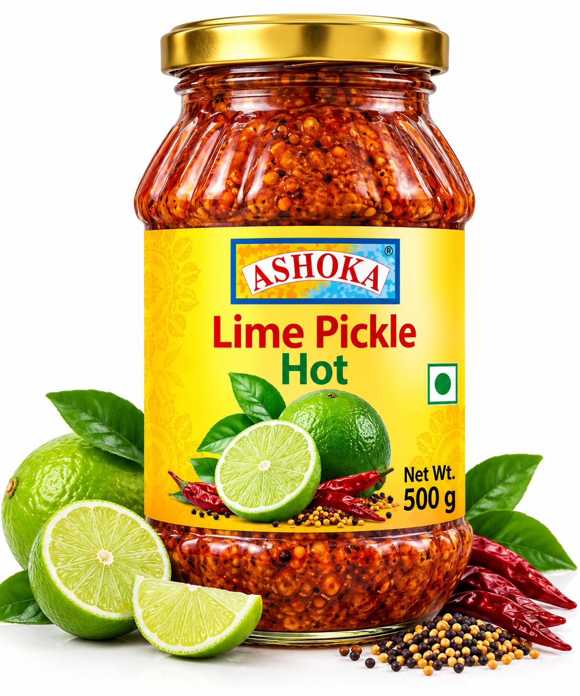 Ashoka Lime Pickle Hot 500g featuring a glass jar with a gold lid and bright yellow label, filled with spicy lime pickle, alongside fresh green limes, sliced lime, green leaves, dried red chillies, mustard seeds, and aromatic Indian spices.