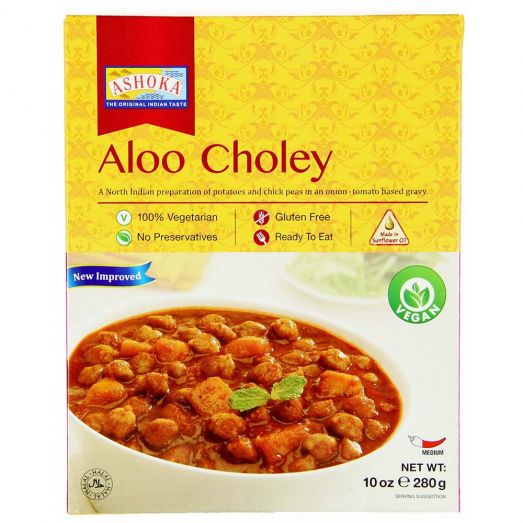 Ashoka Aloo Choley ready to eat Indian curry 280g pouch featuring potatoes and chickpeas cooked in a rich tomato and spice gravy, vegetarian heat and serve meal perfect with rice, roti or naan.