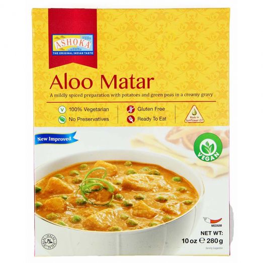 Ashoka Aloo Matar ready to eat Indian curry 280g pouch featuring potatoes and green peas cooked in a rich tomato and spice gravy, vegetarian heat and serve meal perfect with rice, roti or naan.