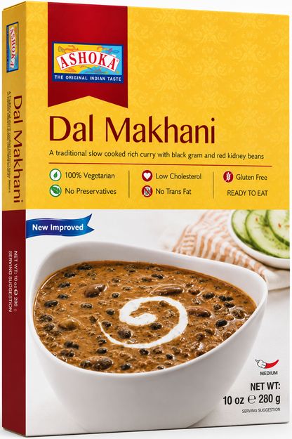 Ashoka Dal Makhani served in a white bowl with creamy black lentil curry, topped with a swirl of fresh cream and coriander.