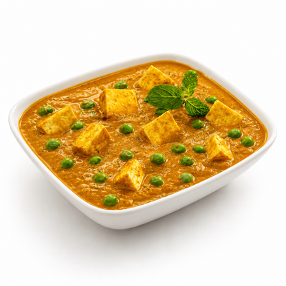 Ashoka Matar Paneer (Tofu) served in a white bowl with tofu cubes and green peas in a rich Indian curry on a clean white background.