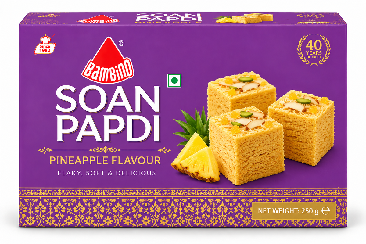 Bambino Soan Papdi Pineapple Flavour 250g sweet box featuring purple packaging with gold decorative patterns, flaky pineapple-flavoured soan papdi cubes, pineapple pieces, almonds, and pistachios.