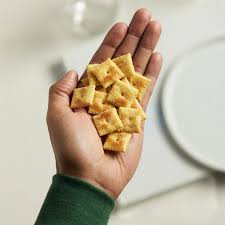 Crispy white cheddar snack crackers on a tabletop