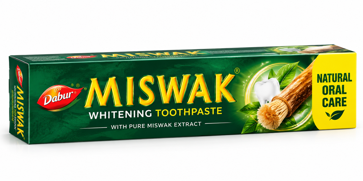 Dabur Miswak Whitening Toothpaste 100g in dark green and yellow packaging, featuring miswak sticks, green leaves and a natural oral care design.