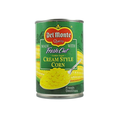 A can of Del Monte Creamed Corn, featuring sweet corn kernels in a creamy sauce. The packaging is bright and colorful, showcasing the Del Monte brand and highlighting the product as a ready-to-serve, convenient side dish.