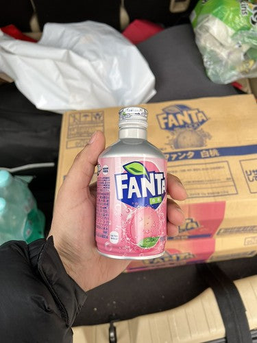 Fanta White Peach 300 ml slim can showing white peach graphics and branding