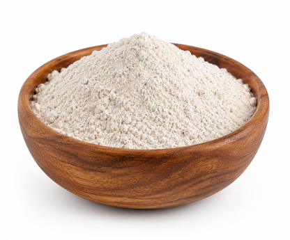 A mound of light beige powder, likely flour or ground coffee, presented in a round wooden bowl against a clean white background.