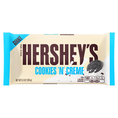 Hershey’s Giant Cookies ’n’ Crème Bar in its wrapper with white crème and cookie pieces displayed.