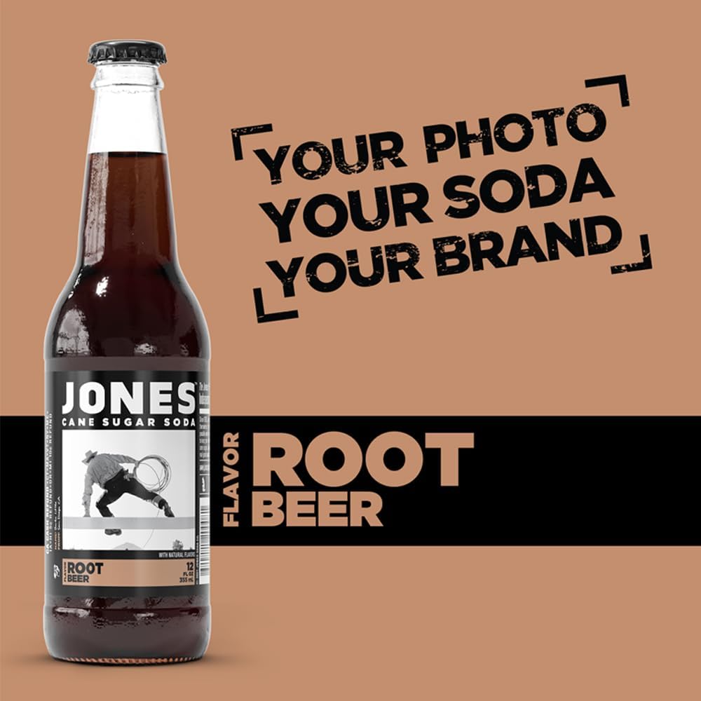 Close-up view of a Jones Soda Root Beer bottle showing the deep brown color of the soda through clear glass, emphasizing its classic root beer appearance and creamy vanilla flavor profile.