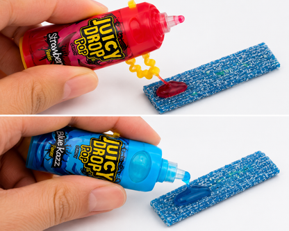 Juicy Drop Pop Strawberry and Blue Razz candy with sour gel being squeezed onto sour candy strips.