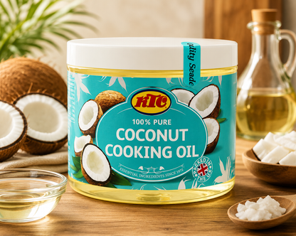 A jar of HHC Coconut Cooking Oil on a wooden table, surrounded by fresh coconuts, a glass bottle of oil, and bowls of ingredients.