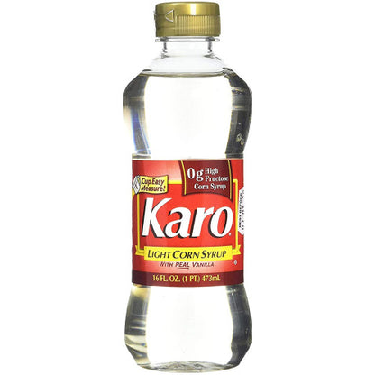 Front view of Karo Light Corn Syrup Red Label showing 16 fl oz bottle for baking, glazes, and candy recipes.