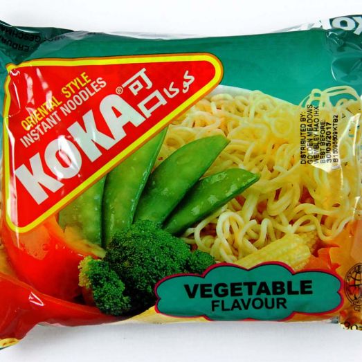 Koka Vegetable Flavour Noodles 85g instant noodle packet featuring bright vegetable-themed packaging, paired with a prepared bowl of wheat noodles mixed with colourful vegetables. Single serve savoury vegetable instant noodles ideal for quick meals, office lunches and student snacks.