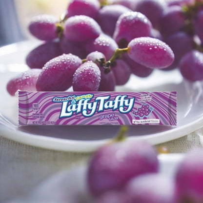 Laffy Taffy Grape bar close-up stretchy fruit-flavoured taffy with jokes on wrappers.