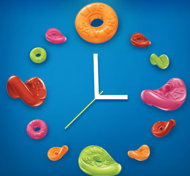 A Life Savers Gummies Collisions Peg Bag, filled with chewy, soft gummies in exciting flavor combinations like cherry-watermelon and orange-pineapple, perfect for sharing or snacking.