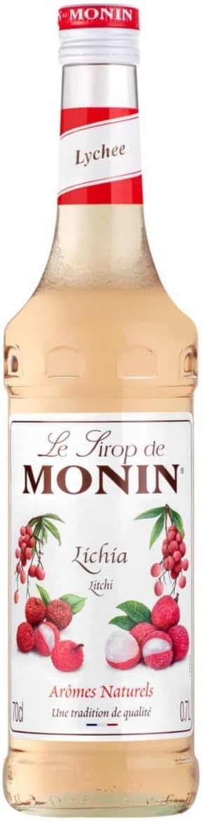 A bottle of Monin Lychee Light syrup, featuring a clear glass bottle filled with pale pink liquid, a red and white cap, and a white label with illustrations of red lychees and green leaves.