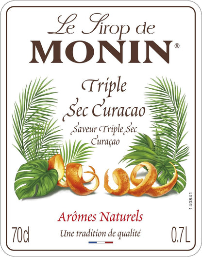 Close-up of the MONIN Triple Sec Curaçao Orange Syrup 700ml label featuring natural orange and citrus flavouring with premium French quality.