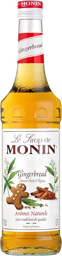 Monin Premium Gingerbread Syrup 700ml bottle with a festive label, featuring a rich gingerbread flavor perfect for coffee, cocktails, and desserts. Vegan-friendly and allergen-free.