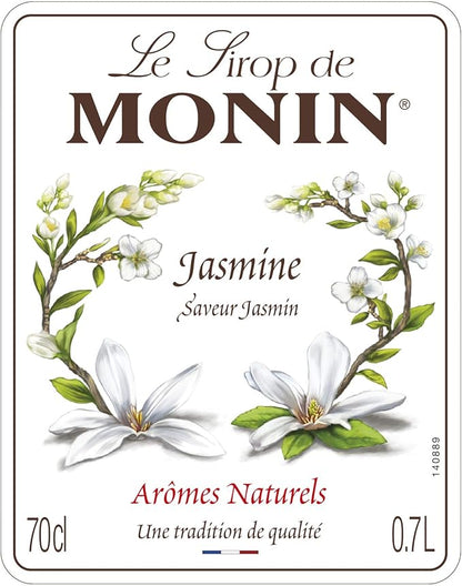 Monin Premium Jasmine Syrup 700ml bottle with a floral design, offering a delicate jasmine flavor perfect for cocktails, mocktails, teas, and desserts. Vegan-friendly and allergen-free.