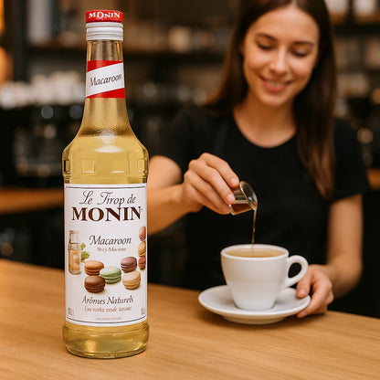 Monin Premium Macaroon Syrup 700ml bottle with a rich almond and vanilla flavor, perfect for cocktails, mocktails, coffees, teas, and desserts. Vegan-friendly, allergen-free, and made with 100% natural ingredients.