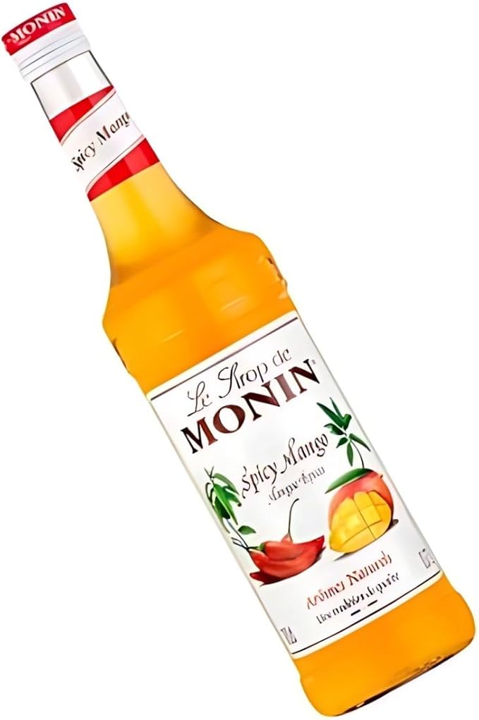 Monin Premium Mango Syrup 700ml bottle featuring sweet, tropical mango flavor. Ideal for cocktails, mocktails, iced teas, smoothies, and desserts. Vegan, allergen-free, and made with 100% natural ingredients.