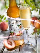 MONIN Premium White Peach Syrup 700ml bottle – vegan, allergen-free drink syrup for cocktails and mocktails