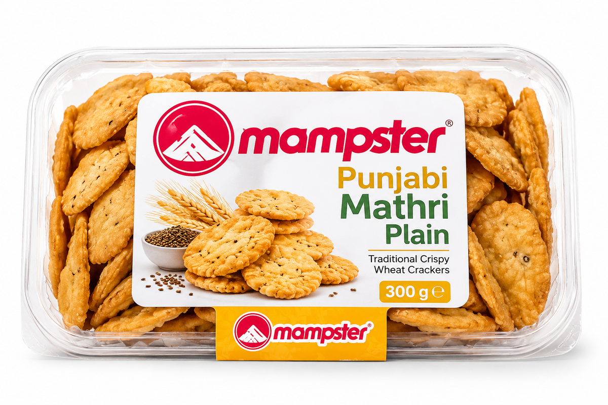 Mampster Punjabi Mathri Plain 300g featuring a clear plastic tray filled with golden, crispy Punjabi mathri crackers and branded packaging with wheat and snack imagery.