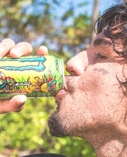 Monster Juice Rio Punch 473ml can, featuring a vibrant tropical fruit punch flavor with passionfruit, orange, and pineapple, offering a refreshing and energizing drink.