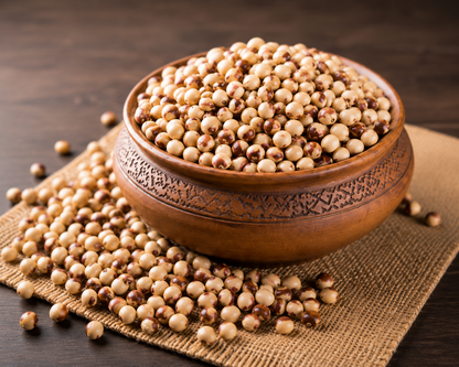 Natco Gungo Peas displayed in a rustic wooden bowl on a natural burlap mat, showcasing premium quality dried gungo peas.