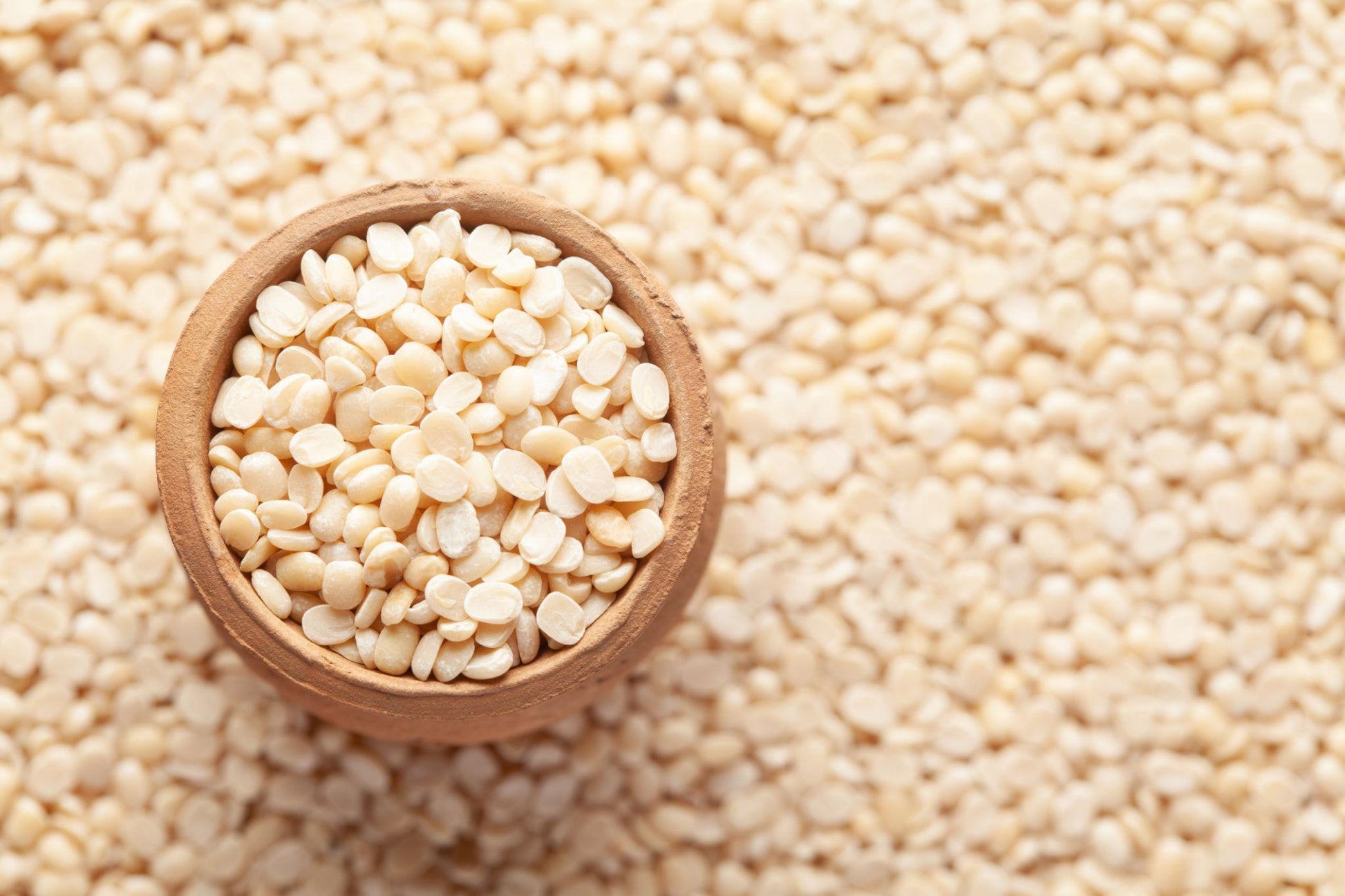 Natco Urid Dal 500g retail pack with split white urad dal (skinless black gram) visible inside the packaging.