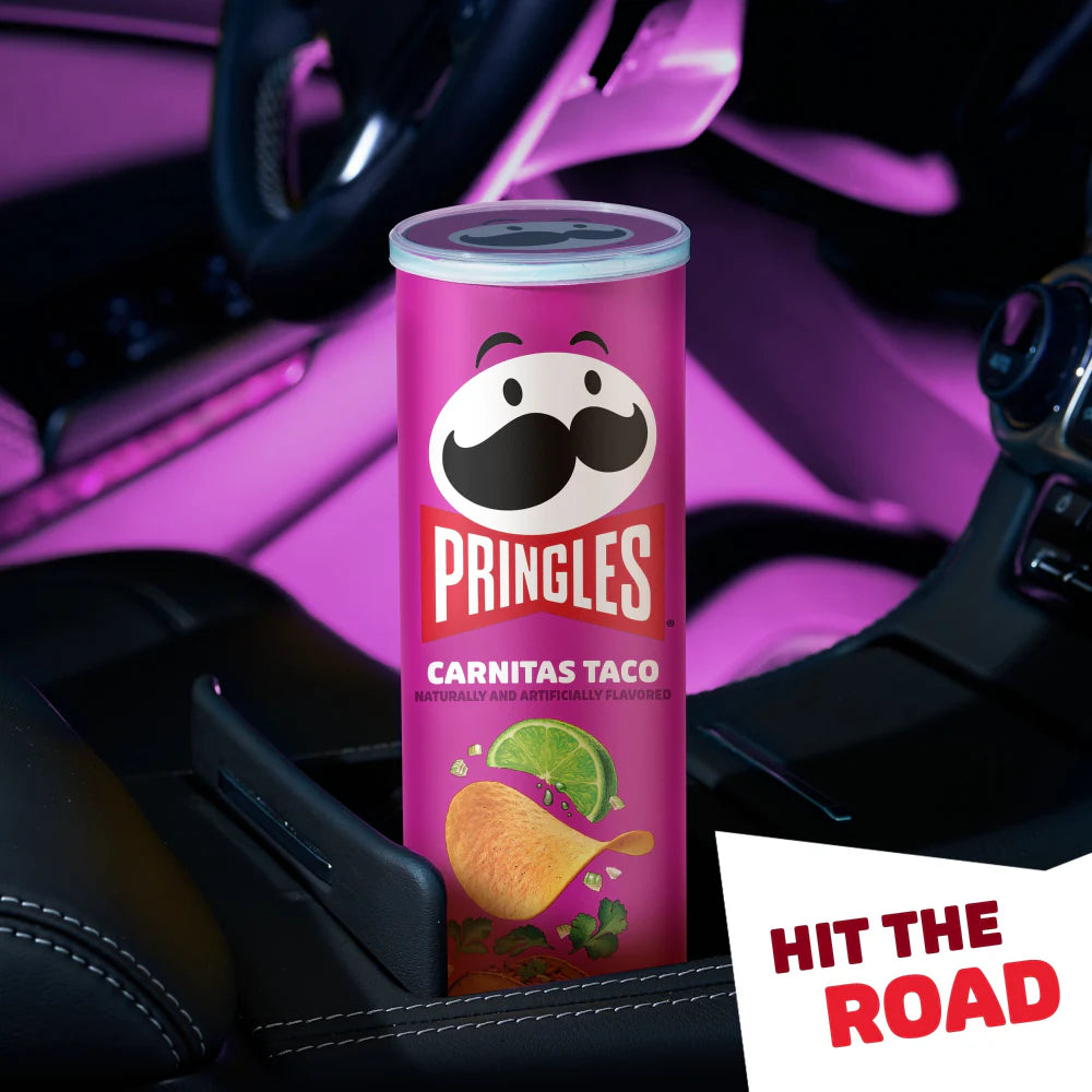 A canister of Pringles Carnitas Taco flavor, featuring stackable, crispy chips coated with savory carnitas seasoning, tangy lime, and a hint of spice. The packaging showcases vibrant taco-inspired graphics and highlights the bold, flavorful taco taste.