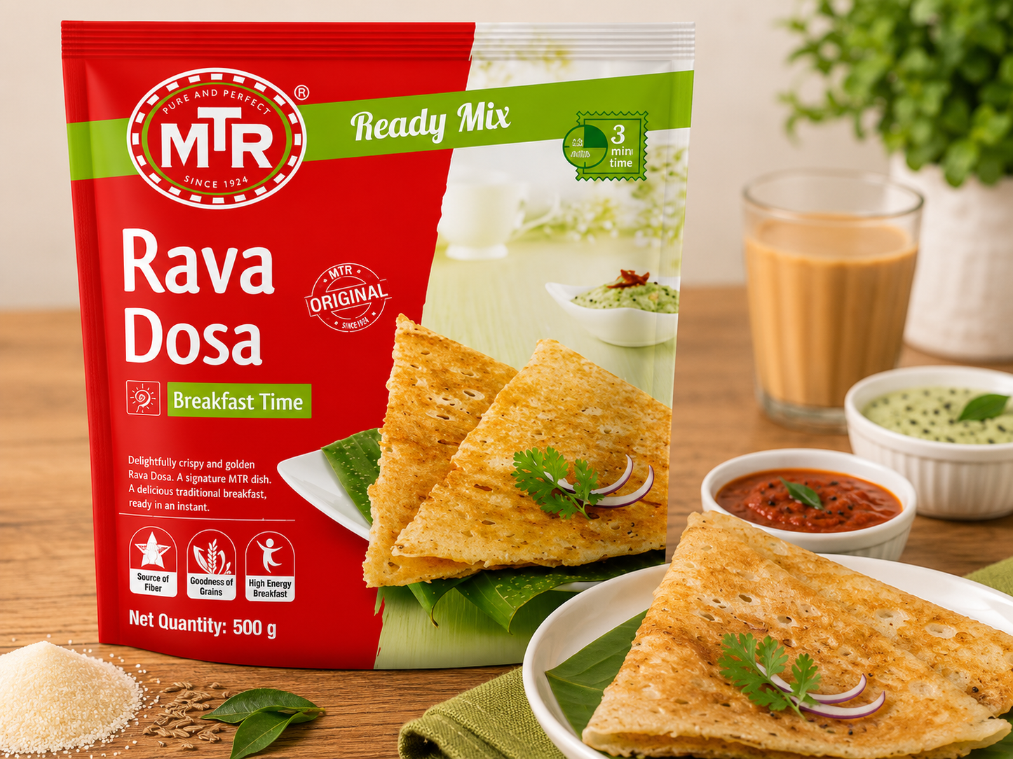 A 500g bag of MTR Ready Mix Rava Dosa (Breakfast Time) shown on a wooden table with prepared food props including a plate of dosas, a bowl of red chutney, and a glass of milk.